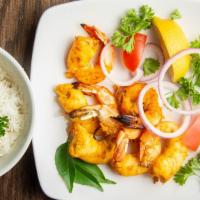Tandoor Prawns · Requires 15 to 20 minutes. Shrimp marinated in yogurt, garlic, ginger and lemon juice, grill...