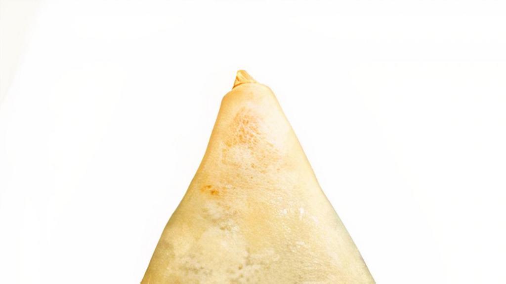 Vegetable Samosa · Deep fried triangular pastry filled with potatoes and spices