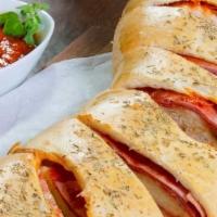 Cheese Stromboli · Our crispy pizza dough filled with mozzarella, wrapped up and baked to perfection.  Served w...