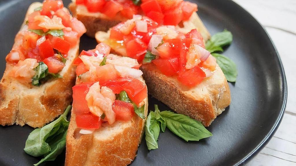 Bruschetta · Toasted Italian bread with diced fresh tomatoes, red onions, garlic, fresh basil and extra virgin olive oil.
