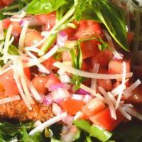 Chicken Milanese Dinner · Breaded chicken cutlet served over baby arugula, tomatoes, red onions, shaved parmigiana che...
