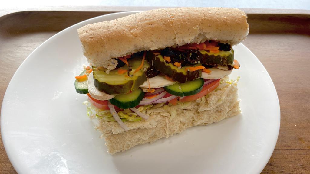 Good Earth Sub & Cheese · Lettuce, tomatoes, onions, carrots, cucumbers, black olives, dill pickles, bean sprouts, mushrooms, oil, vinegar & oregano.