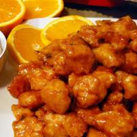 Orange Chicken · Hot and spicy. Tender slices of chicken sautéed with orange peels and hot pepper in a sweet ...