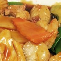 Happy Family · Shrimp, chicken, pork, scallops sautéed with vegetable in brown sauce.