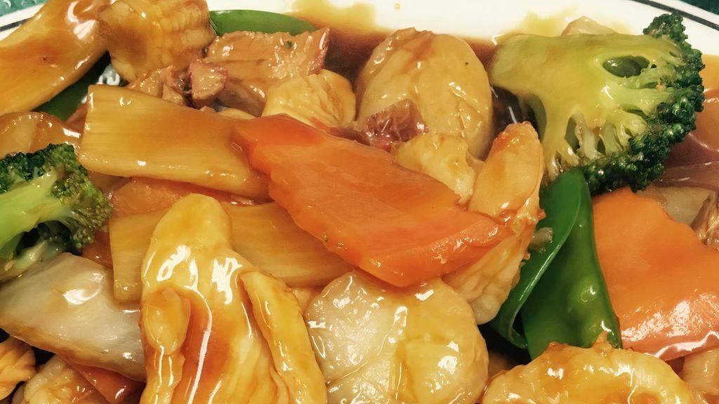 Happy Family · Shrimp, chicken, pork, scallops sautéed with vegetable in brown sauce.