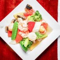 Shrimp & Scallops · Shrimp and scallops, sautéed with vegetables in a wine sauce.
