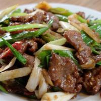 Mongolian Beef · Hot and spicy.  Sliced beef with scallions in hoisin sauce.