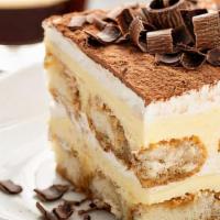 Tiramisu · Zabaione cream divided by three layers of espresso soaked sponge cake and dusted with cocoa ...