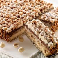 Torta Alla Nocciola · Alternating layers of hazelnut cake, hazelnut cream and chocolate cream, topped with praline...