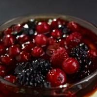 Crème Brûlée & Berries · A layer of raspberry sauce topped with a creamy custard and decorated with mixed berries coa...
