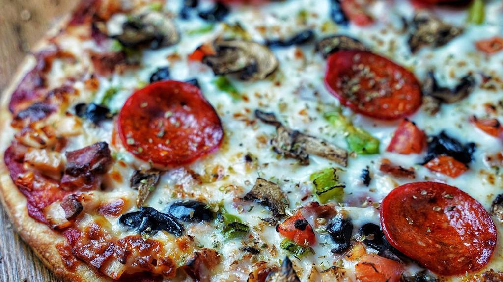 Hayat Special Pizza · House made dough, pizza sauce beef and chicken Jambon, green pepper, mushroom, black olive, tomato, halal pepperoni and mozzarella cheese