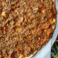 Lahmacun · House made dough, ground beef, tomato, green pepper, red pepper, onion, garlic, parsley and ...
