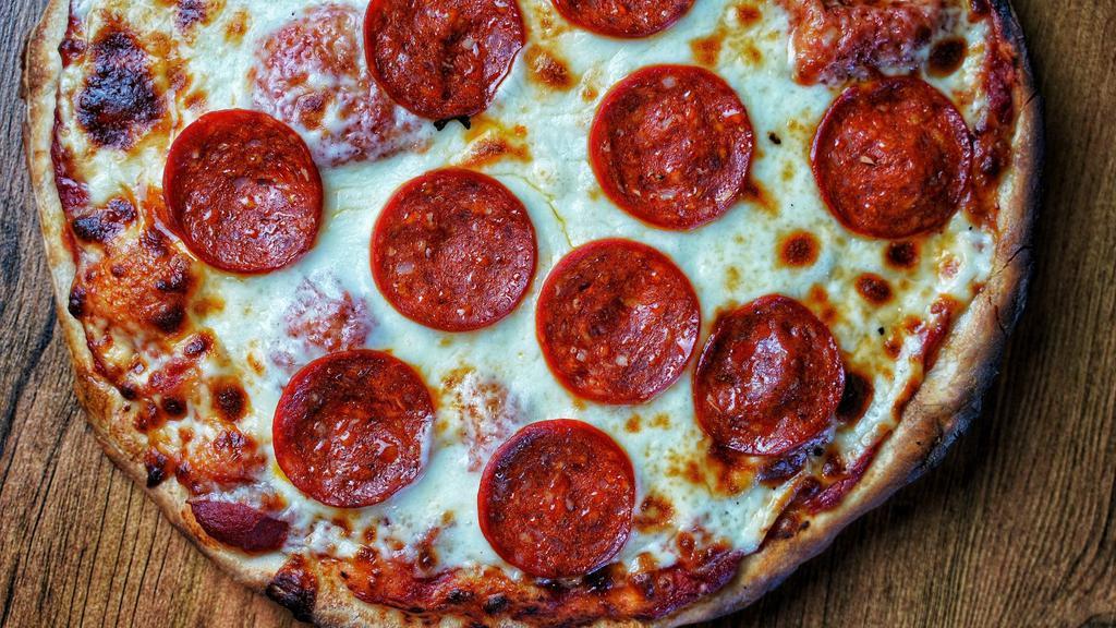 Pepperoni Pizza · House made dough, pizza sauce, halal pepperoni and mozzarella cheese