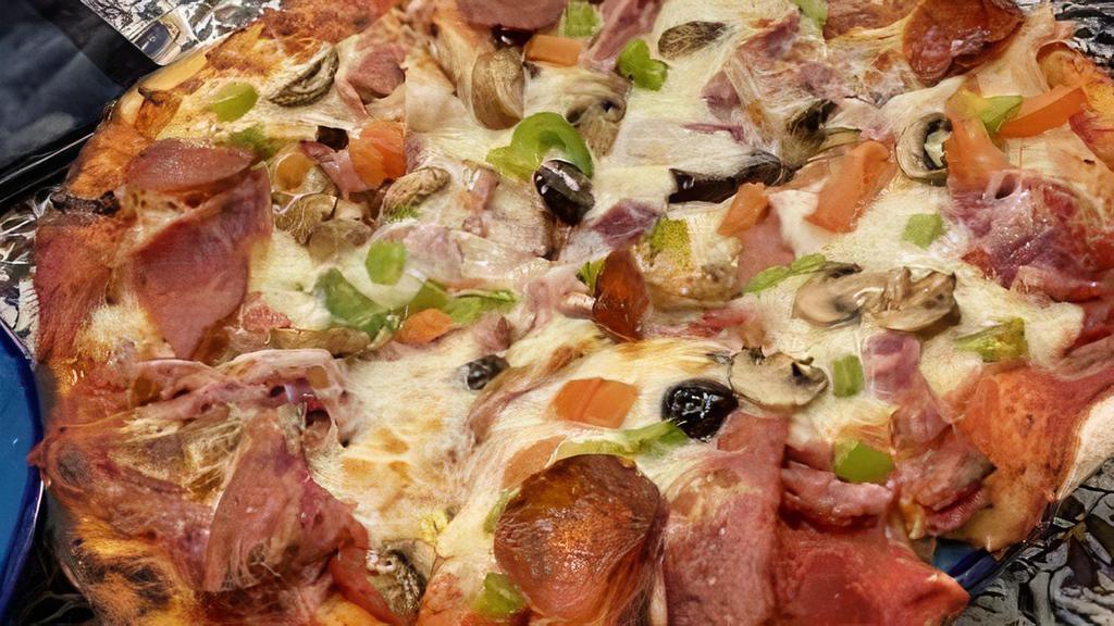 Veggie Pizza · House made dough, pizza sauce, green pepper, mushroom, black olive, tomato and mozzarella cheese