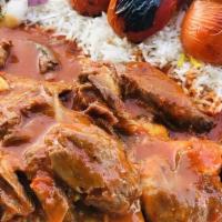 Hayat Special Lamb Shank · Lamb shank with eggplant, tomato and green pepper Served with Rice, red cabbage pickles, oni...