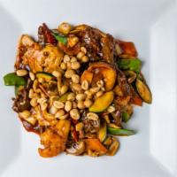 Kung Pao Triple Delight 宫保三样 · Comes with carrots, snow peas, water chestnuts and Napa in spicy brown sauce with peanuts an...