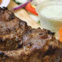 A-2 Chopan Kabob · Pieces of tender Lamb chops marinated in special herbs and spices and broiled on a skewer
