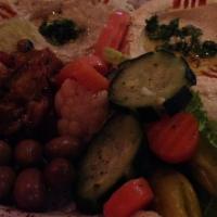 Sampler · Hummus, zaalouk, baba ganoush, pickled vegetables, seasoned olives.