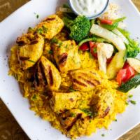 Chicken Kabob · Breast of chicken marinated with garlic, Marakesh spice blend, olive oil. Served with vegeta...