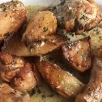 Chicken Vesuvio · 1/2 chicken and potatoes seasoned with garlic and fresh herbs in a white wine sauce. Served ...