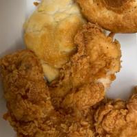 Family Tenders · 12 pieces of Cajun tenders, six biscuits and family fries. Serves four to six people.