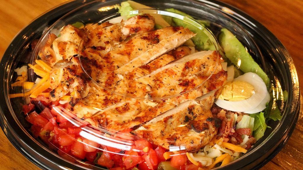 Chopped Cobb Salad · Mixed greens with grilled chicken, cheddar-jack blend cheese, hard boiled egg, bacon, avocado, tomato, and bleu cheese crumble topped with your choice of dressing.

Consuming raw or undercooked meats, poultry, seafood, shellfish, or eggs may increase risk of foodborne illness.