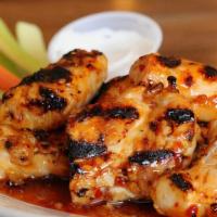 Grilled Chicken Bites (10 Pieces) · Grilled to perfection bite-sized chunks of white meat, tossed in your choice of specialty sa...