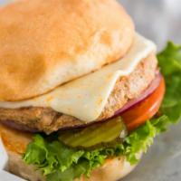 The Turkey Burger · Juicy turkey patty, Swiss cheese, green leaf lettuce, juicy tomatoes, pickles, red onions, m...