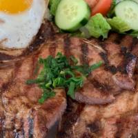 Pork Chop Over Rice With Poached Egg · Our food may contain peanut or tree nut products.