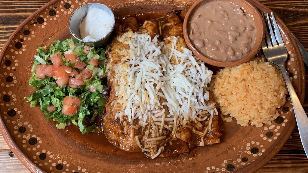Enchiladas (3) · Rojas, verdes, mole. served with a side of rice, beans choice of steak, cheese, or chicken