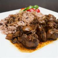 Brown Stewed Chicken · Small pieces of chicken lighty fried then simmered in a tangy sauce.