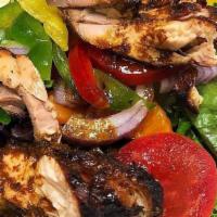 Jerk Chicken Salad · Spring Mix salad tossed with cucumbers and tomatoes topped with  grilled jerk chicken. Serve...