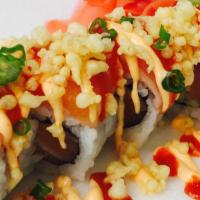 Deluxe Spicy Salmon Roll · Spicy crunchy salmon topped with salmon, spicy mayo, crunch, green onion and hot chili sauce...
