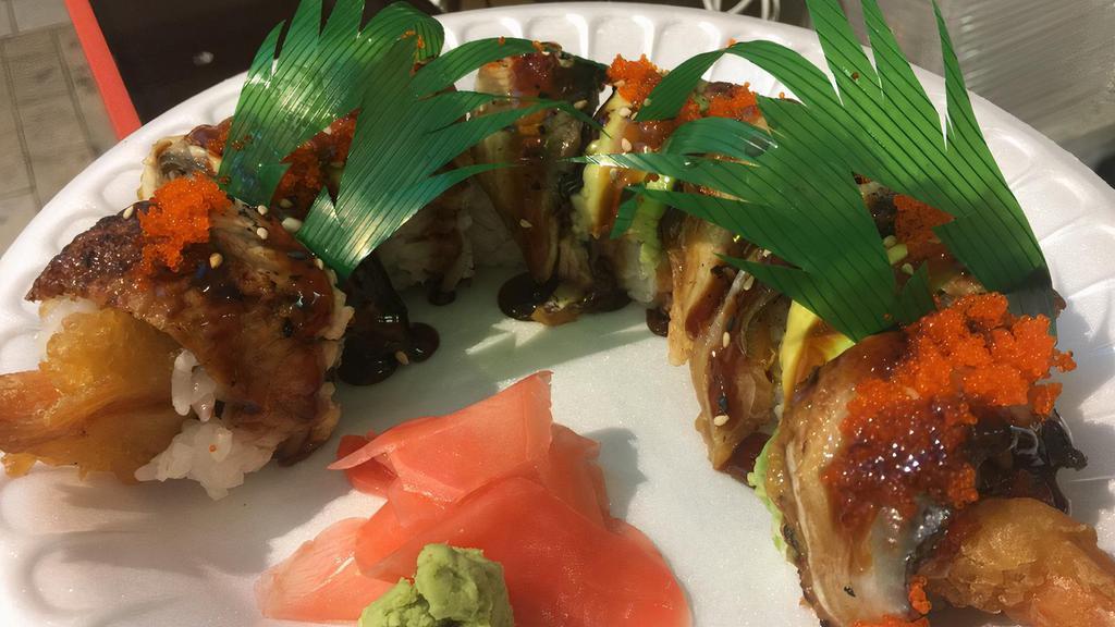 Flying Dragon Roll · Double shrimp tempura and cucumber topped with eel, avocado and eel sauce. 8 pieces.