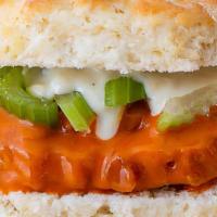 Buffalo Chicken · Tossed in Buffalo sauce and topped with diced celery and blue cheese sauce.