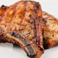 Bbq Pork Chops · Two pork chops (160z), BBQ sauced and grilled, seved with mash potatoes.