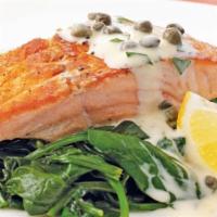 Salmon Piccatta · 8oz north altlantic salmon, oven baked and served with garlic spinach in lemon butter capers...