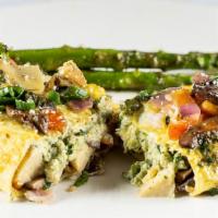 Pesto Ricotta + Spring Veggie Omelet · Cage-free + cracked fresh, this three egg omelet is filled w/ pesto ricotta cheese, a vegeta...