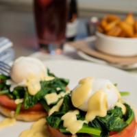 Florentine · Garden tomato, warmed spinach + hollandaise sauce on a toasted English muffin.