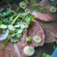 Filet Mignon Pho · beef broth simmered for over 12 hours, packed with vitamins and minerals, topped with filet ...