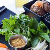 Bun Cha Hanoi · Grilled pork patties steeped in nuoc cham, vermicelli, vegetables, herbs.