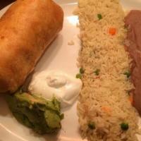 Chimichangas · Stuffed flour tortillas with your choice of chicken or ground beef and cheddar cheese, Deep ...