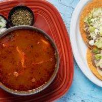 Pozole · Traditional hominy soup, a little spicy, with chicken. Served with two tostadas with lettuce...