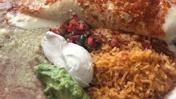 Burrito Jose · Stuffed with pork,  cooked with tomatoes, onions, bell peppers. Served with rice and beans. Topped with melted cheese and red sauce.