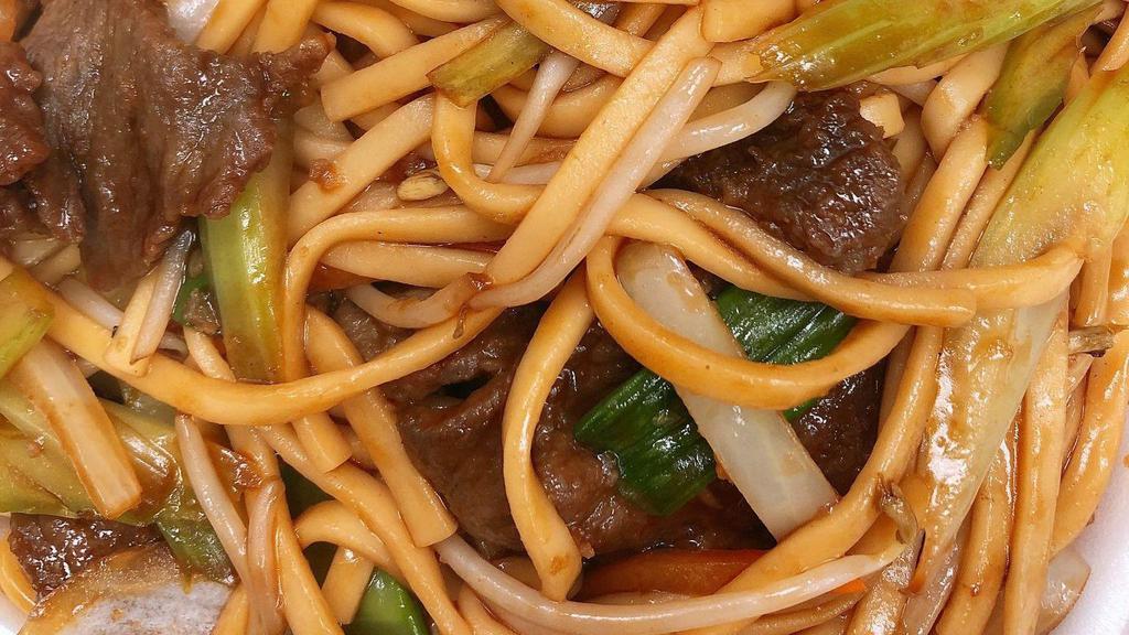 Beef Lo-Mein · Beef and lo-mein noodles with nappa snow peas sprouts green onions and celery stir-fried with light brown sauce.
