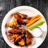 Chicken Wings · Choice of: buffalo, lemon pepper, or whiskey BBQ.