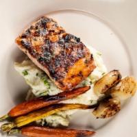 Herb-Crusted Salmon · Colcannon mashed potatoes, baby carrots.