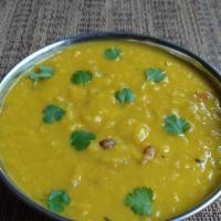 Lentil Soup · An authentic Nepalese soup of lentils, onion, tomatoes and flavored with fresh herbs.