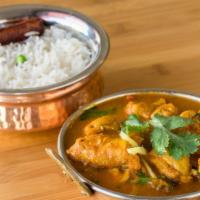 Chicken Curry · Boneless chicken cooked in a special curry sauce with herbs and spices. served with basmati ...