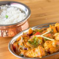 Fish Curry · Boneless fish cooked in a creamy coconut sauce and spices. served with basmati rice on the s...